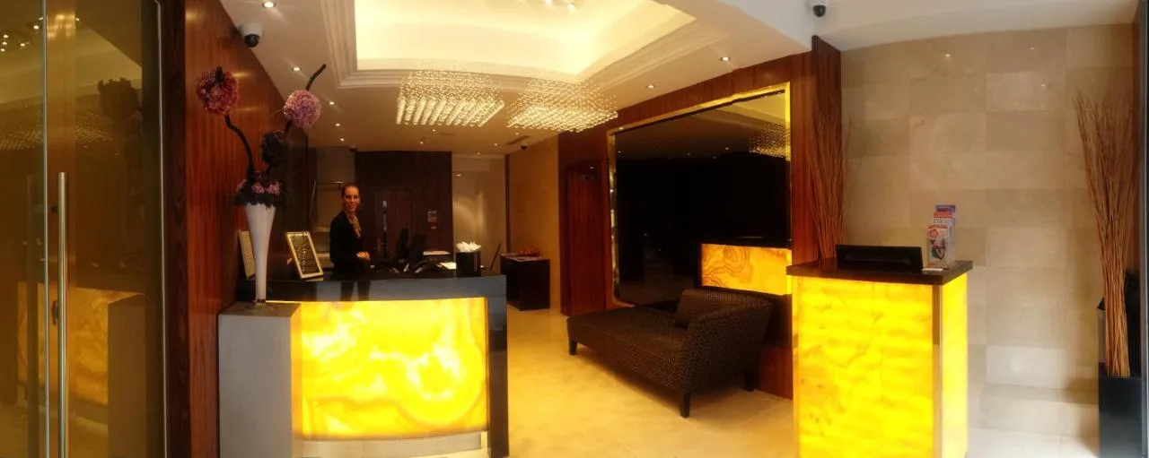 A man standing in the hotel lobby at Montcalm Piccadilly Townhouse, London West End